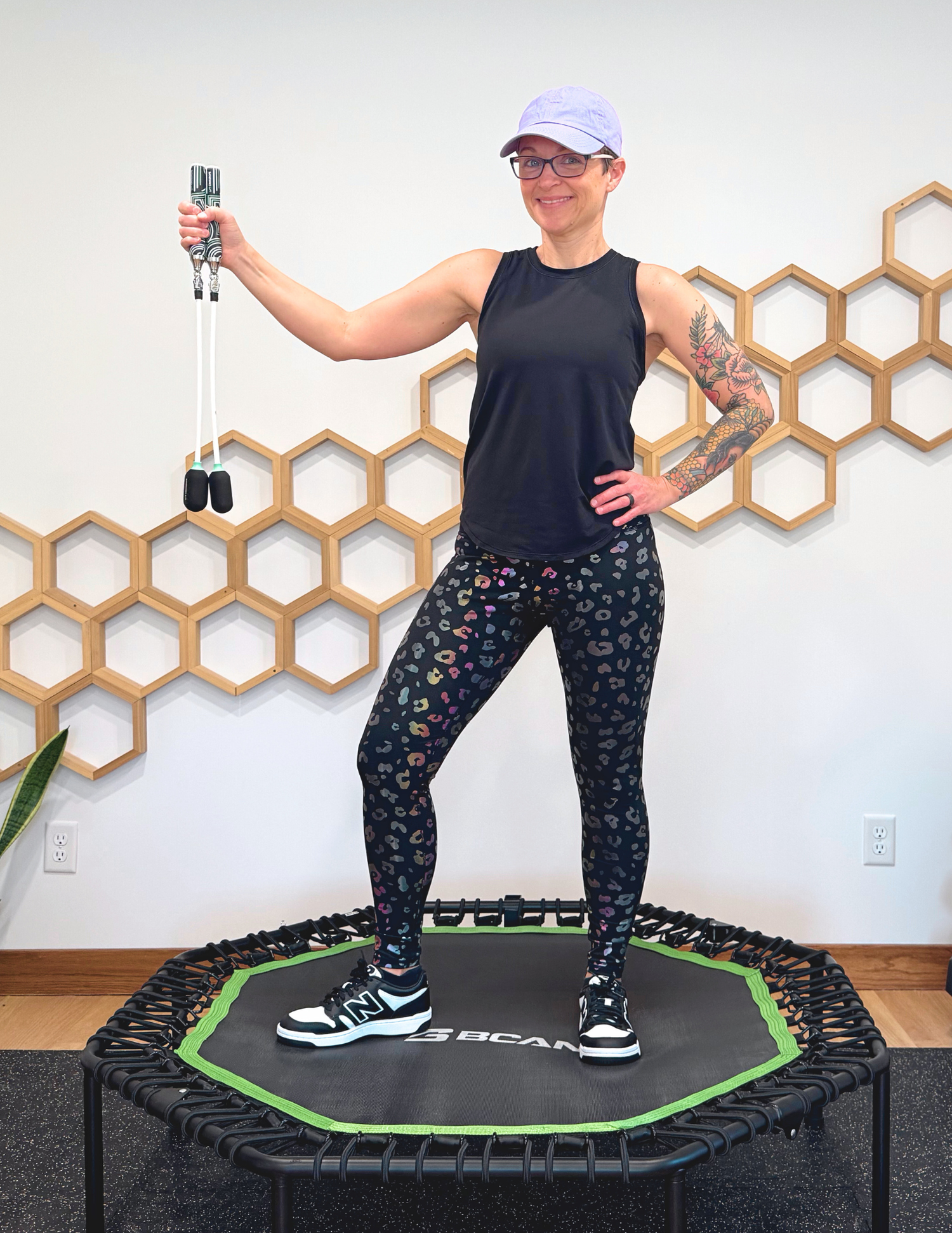 Person exercising on a mini trampoline with a ropeless jump rope.